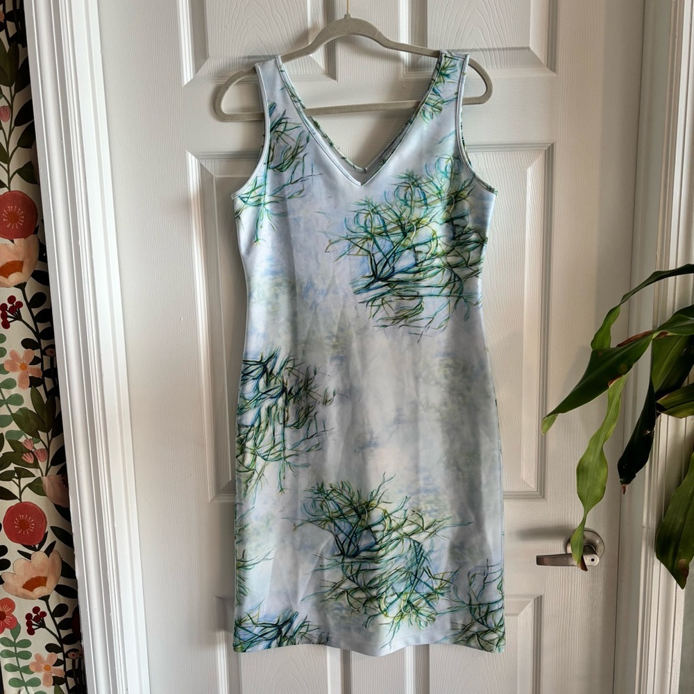 Sleeveless Light Blue V-Neck Midi Dress with Green Floral Print